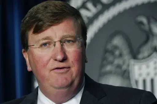 Gov. Tate Reeves responds to a reporter's question during a news briefing regarding Mississippi's COVID-19 response in Jackson, Miss., Thursday, Aug. 19, 2021. (AP Photo/Rogelio V. Solis)