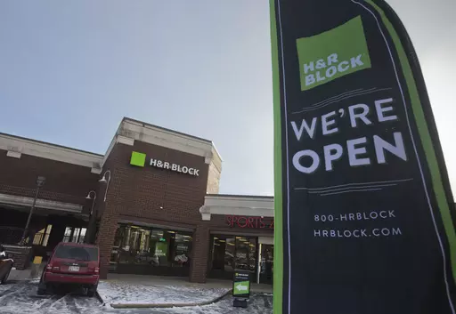 An ad banner appears in the parking lot of the H&R Block offices on Thursday, Jan. 8, 2015, in the Atlas District in Washington. (AP Photo/Pablo Martinez Monsivais, File)