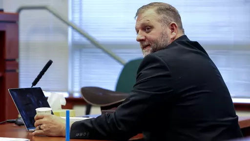 Ammon Bundy glances toward the prosecution table during a pause in his trial to clarify a line of questioning with the jury dismissed in Ada County Magistrate Judge Kim Dale's courtroom on March 15, 2022, in Boise, Idaho. A jury on Monday, July 24, 2023, awarded an Idaho hospital more than $50 million in damages in a defamation case the institution brought against far-right activist Ammon Bundy and others. (Darin Oswald/Idaho Statesman via AP, File)