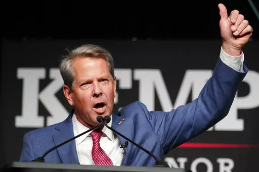 Republican Gov. Brian Kemp waves to supporters during an election night watch party, Tuesday, May 24, 2022, in Atlanta. Kemp easily turned back a GOP primary challenge Tuesday from former U.S. Sen. David Perdue, who was backed by former President Donald Trump. (AP Photo/John Bazemore)