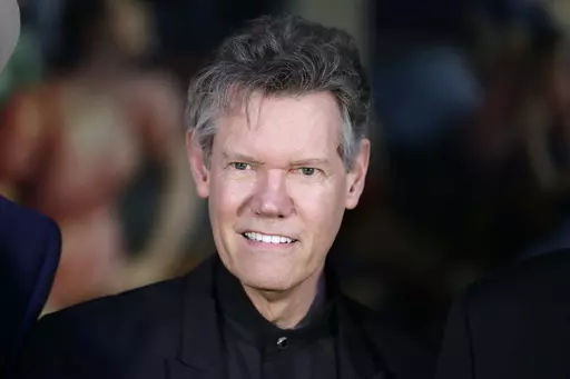Randy Travis attends the announcement of the Country Music Hall of Fame inductees in Nashville, Tenn., on March 29, 2016. (AP Photo/Mark Humphrey, File)