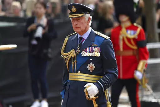 Britain's King Charles III walks behind the coffin during the procession for Queen Elizabeth II, in London, Wednesday, Sept. 14, 2022. The Queen will lie in state in Westminster Hall for four full days before her funeral on Monday Sept. 19. (Kate Green/Pool Photo via AP)