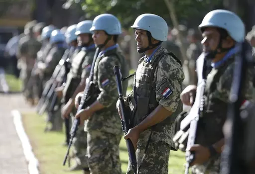 Soldiers line up at the United Nations Peace Operations Training Center (CECOPAZ) before the arrival of United Nations Secretary-General Ban Ki-Moon in Asuncion, Paraguay, on Feb. 26, 2015. The organization is marking the 75th anniversary of U.N. peacekeeping and observing the International Day of United Nations Peacekeepers on Thursday, May 25, 2023. (AP Photo/Jorge Saenz, File)