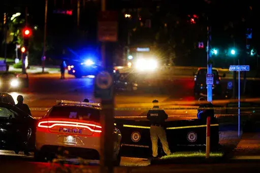 Memphis Police officers work an active shooter scene on Poplar Avenue in Memphis, Tenn. Wednesday, Sept. 7, 2022. Police in Memphis, Tennessee, said a man who drove around the city shooting at people during an hours-long rampage that forced frightened people to shelter in place Wednesday has been arrested. (Mark Weber/Daily Memphian via AP)