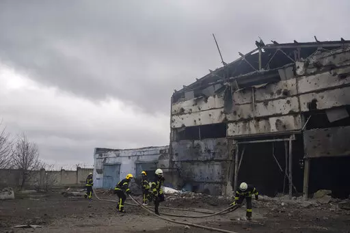 Firefighters try to extinguish the fire at a damaged factory following a Russian bombing in Kramatorsk, Ukraine, Thursday, April 14, 2022. (AP Photo/Petros Giannakouris)