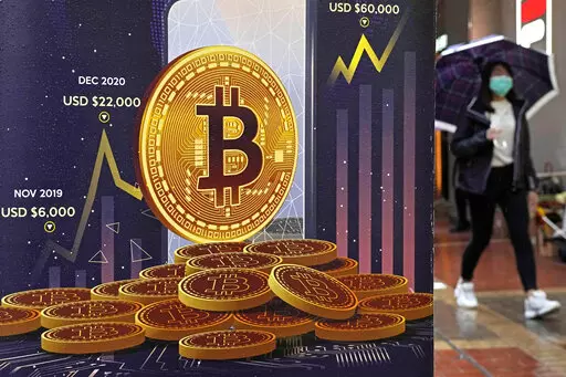 An advertisement for Bitcoin cryptocurrency is displayed on a street in Hong Kong, on Feb. 17, 2022. Europe is poised to take the global lead in regulating the freewheeling cryptocurrency industry at a time when prices have plunged, wiping out fortunes, fueling skepticism and sparking calls for tighter scrutiny. European Union negotiators were set to hold talks on Thursday, June 30, 2022, to hammer out the final details in the bloc's sweeping package of crypto rules. (AP Photo/Kin Cheung, File)