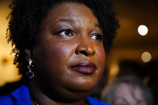 Georgia gubernatorial Democratic candidate Stacey Abrams talks to the media after qualifying for the 2022 election on Tuesday, March 8, 2022, in Atlanta. When she ended her first bid to become Georgia governor in 2018, Abrams announced plans to sue over the way the state’s elections were managed. More than three years later, as she makes another run at the governor’s mansion, the lawsuit filed in Nov. 2018 by Abrams' Fair Fight Action organization is finally going to trial on Monday, April 1