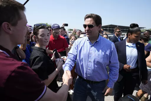 Republican presidential candidate Florida Gov. Ron DeSantis greets supporters at U.S. Sen. Joni Ernst's Roast and Ride, Saturday, June 3, 2023, in Des Moines, Iowa. (AP Photo/Charlie Neibergall)