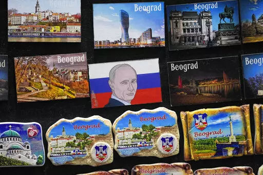 A vendor sells refrigerator magnets showing a picture of Russian President Vladimir Putin, on main pedestrian street in downtown Belgrade, Serbia, Monday, Jan. 16, 2023. Since the start of the war in Ukraine, about 200,000 Russians have left their homeland for Serbia, with many seeking a new life in a fraternal Slavic country free from Kremlin oppression. The Balkan country is a close ally of Moscow, with historic, religious and cultural ties, and Russia backs Serbia’s claim over its former pr