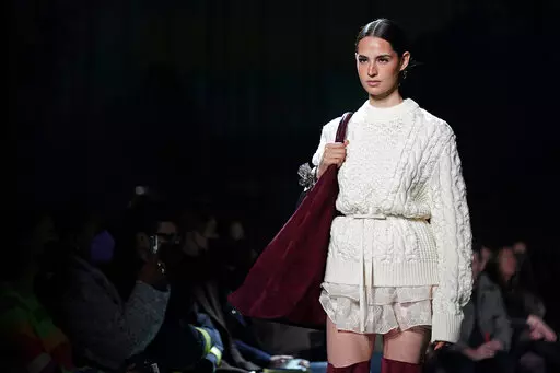 The Brandon Maxwell fall/winter 2022 collection is modeled during New York Fashion Week at the Daryl Roth Theatre on Saturday, Feb. 12, 2022, in New York. (Photo by Charles Sykes/Invision/AP)