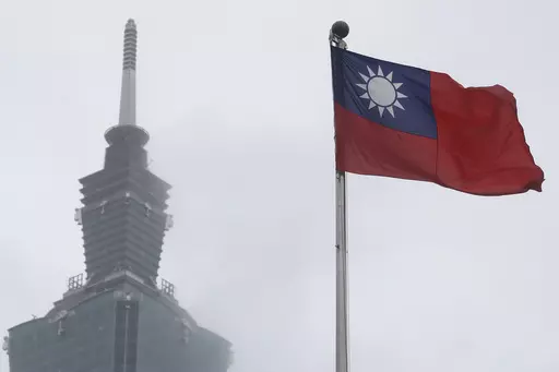 A Taiwan national flag flutters near the Taipei 101 building at the National Dr. Sun Yat-Sen Memorial Hall in Taipei, Taiwan, on May 7, 2023. Taiwan said Wednesday, Nov. 1, 2023 that China sent 43 military aircraft and seven ships near the self-ruled island, the latest sign that Beijing plans no let-up in its campaign of harassment, threats and intimidation. (AP Photo/Chiang Ying-ying, File)