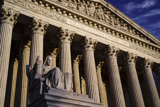 The Supreme Court is seen at dusk in Washington on Oct. 22, 2021. The Supreme Court is hearing a case its conservative majority could use to hobble Biden administration efforts to combat climate change. In arguments Monday, Feb. 28, 2022, justices are taking up an appeal from 19 mostly Republican-led states and coal companies over the Environmental Protection Agency's authority to limit carbon dioxide emissions from power plants. (AP Photo/J. Scott Applewhite, File)