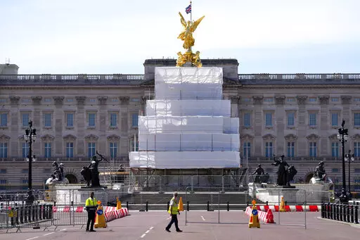 Building work in preparation for the Platinum Jubilee celebrations take place in front of Buckingham Palace in London, Friday, May 6, 2022. Britain's Queen Elizabeth II acceded to the throne on the death of her father King George VI on Feb. 6, 1952, and the Platinum Jubilee bank holiday weekend celebrations will take place on June 2-5. (AP Photo/Kirsty Wigglesworth)