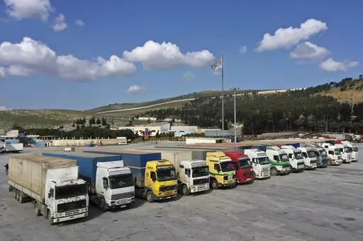 Trucks loaded with United Nations humanitarian aid for Syria following a devastating earthquake are parked at Bab al-Hawa border crossing with Turkey, in Syria's Idlib province, on Feb. 10, 2023. The U.N. secretary general is hoping that the Security Council will vote later this month to keep a key border crossing from Turkey to Syria’s rebel-held northwest open for critical aid deliveries for a period of one year instead of six months. (AP Photo/Ghaith Alsayed, File)