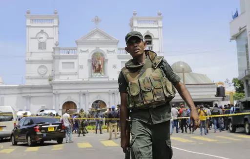 FILE- In this April 21, 2019 file photo, Sri Lankan army soldiers secure the area around St. Anthony's Shrine after a blast on Easter Sunday in Colombo, Sri Lanka. Sri Lanka’s president said Sunday he will appoint a committee chaired by a retired Supreme Court judge to investigate allegations made in a British television report that the South Asian country’s intelligence was complicit in the 2019 Easter Sunday bombings that killed 269 people. (AP Photo/Eranga Jayawardena, File)