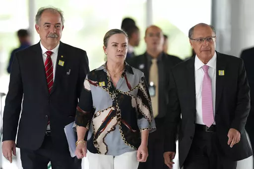 Economist Aloizio Mercadante, from left, Workers' Party President Gleisi Hoffmann and Brazil's Vice President-elect Geraldo Alckmin, arrive for a press conference after meeting with Ciro Nogueira, outgoing President Jair Bolsonaro's chief of staff, at the Planalto Presidential Palace, in Brasilia, Brazil, Thursday, Nov. 3, 2022. President-elect Luiz Inacio Lula da Silva’s team arrived in Brazil’s capital Thursday to begin the process of transferring power. (AP Photo/Eraldo Peres)