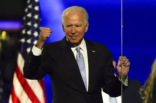 Then-President-elect Joe Biden gestures to supporters Nov. 7, 2020, in Wilmington, Del. Some voters in last year's midterm elections were open to supporting Democrats even if they weren't fond of President Joe Biden. Roughly 1 in 6 voters for Democratic House candidates said they disapproved of Biden's job performance, but most said Biden wasn't a factor in their midterm decision. (AP Photo/Andrew Harnik, File)