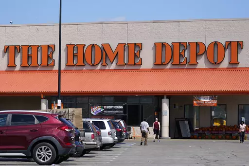 Cars are parked at a Home Depot in Philadelphia, on Sept. 21, 2022. After years of explosive growth during the pandemic, Home Depot's revenue during the first quarter fell short of expectations and the company cut its profit and sales outlook for the year, sending shares skidding before the opening bell Tuesday May 16, 2023. (AP Photo/Matt Rourke, File)
