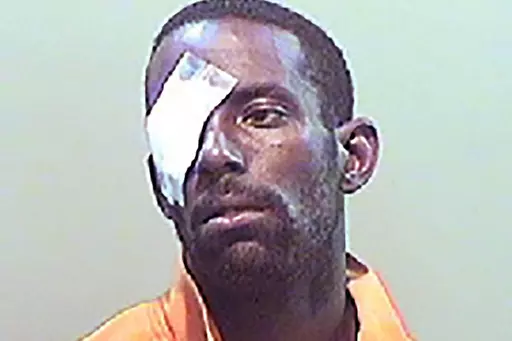 This undated booking photo released by Detroit Police Department shows DeAngelo Kenneth Martin. Repeatedly over 15 years Detroit police failed to follow up on leads or take investigative steps that may have averted his killing spree, despite having received repeated warnings that Martin was a violent predator, an Associated Press investigation has found. (Detroit Police Department via AP)