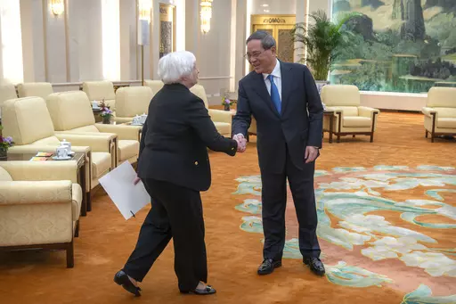 Chinese Premier Li Qiang, right, shakes hands with Treasury Secretary Janet Yellen, left, during a meeting at the Great Hall of the People in Beijing, China, Friday, July 7, 2023. (AP Photo/Mark Schiefelbein, Pool)