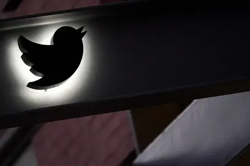 The Twitter logo is seen on the awning of the building that houses the Twitter office in New York, on Oct. 26, 2022. The European Union says blue checkmarks from Elon Musk’s X are deceptive and that the online platform falls short on transparency and accountability requirements. (AP Photo/Mary Altaffer, File)