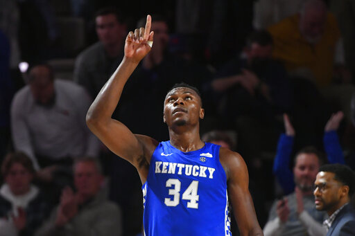 Kentucky forward Oscar Tshiebwe (34) as after an NCAA college basketball game against Vanderbilt comes to an end, Tuesday, Jan. 11, 2022, in Nashville, Tenn. Kentucky won 78-66. (AP Photo/John Amis)