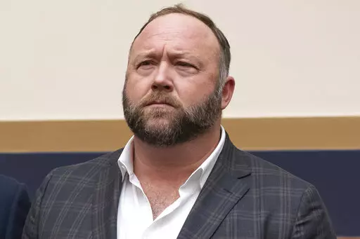 This Tuesday, Dec. 11, 2018, photo shows radio show host and conspiracy theorist Alex Jones at Capitol Hill in Washington. Jones was being questioned Wednesday, April 6, 2022, by lawyers for families of Sandy Hook Elementary School victims in Connecticut, where a judge had ordered the Infowars host to face mounting fines until he appeared for a deposition. (AP Photo/J. Scott Applewhite, File)