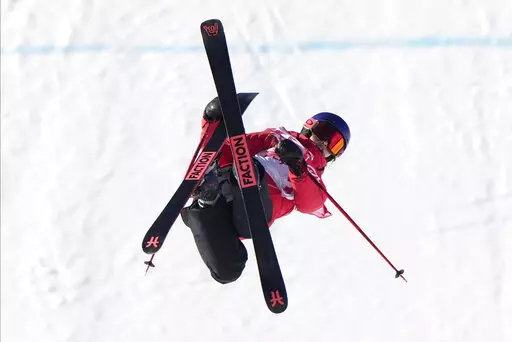 China's Eileen Gu competes during the women's slopestyle qualification at the 2022 Winter Olympics, Monday, Feb. 14, 2022, in Zhangjiakou, China. (AP Photo/Francisco Seco)