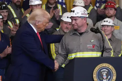 President Donald Trump shakes hands with coal miner Jeff Crowe during an event on energy production in the East Room of the White House, Tuesday, April 8, 2025, in Washington. (AP Photo/Alex Brandon)