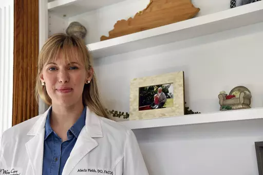 OB/GYN Dr. Alecia Fields stands for a portrait in her home in rural Kentucky on Saturday, June 10, 2023. Fields, who has been an advocate for reproductive rights, said the overturning of Roe v. Wade leak brought up “a lot of fears” and made her wonder: “What is this going to mean on the ground? Am I going to be criminalized?” (AP Photo/Timothy D. Easley)