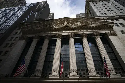 Statues adorn the facade of the New York Stock Exchange, July 14, 2022, in New York.  Stocks are opening lower on Wall Street, putting the S&P 500 index on track to break a four-week winning streak. The benchmark index was off 0.9% in the early going Friday, Aug. 19.  (AP Photo/John Minchillo, File)