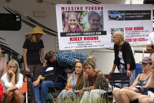 Lindsey Rodni-Nieman, center, mother of missing 16-year-old Kiely Rodni, listens to law enforcement during a news conference, Tuesday, August 9, 2022, in Truckee, Calif. (Paul Kitagaki Jr./The Sacramento Bee via AP)