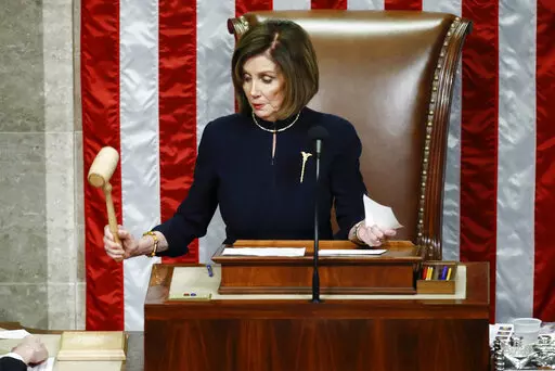 House Speaker Nancy Pelosi of Calif., strikes the gavel after announcing the passage of article II of impeachment against President Donald Trump, Dec. 18, 2019, on Capitol Hill in Washington. (AP Photo/Patrick Semansky, File)