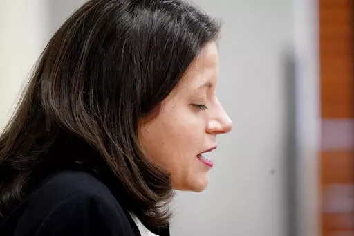 CORRECTS TO ASHLEY, NOT ASHELY - Ashley Allen closes her eyes as she leads prayer during a woman's ministry class at the Southwestern Baptist Theological Seminary in Fort Worth, Texas, Thursday, Nov. 18, 2021. (AP Photo/LM Otero)