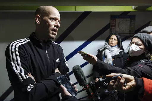Palestinian French lawyer and activist Salah Hammouri talks with the press as he arrives at the Charles de Gaulle Airport after his extradition from Israel to France, Sunday, Dec. 18, 2022, in Paris. Israel said it deported Hammouri to France early Sunday, claiming he has ties to a banned militant group, despite objections from the French government. (AP Photo/Lewis Joly)