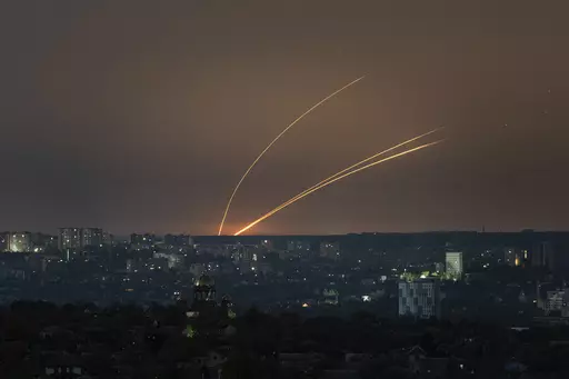 Russian rockets are launched against Ukraine from Russia's Belgorod region, seen from Kharkiv, Ukraine, on Thursday, April 18, 2024. (AP Photo/Evgeniy Maloletka)