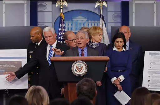 Dr. Anthony Fauci, director of the National Institute of Allergy and Infectious Diseases speaks in the briefing room of the White House in Washington, Tuesday, March, 10, 2020, about the coronavirus outbreak as Vice President Mike Pence, second from left gestures to a display. Also onstage from left are U.S. Surgeon General Jerome Adams, Pence, White House chief economic adviser Larry Kudlow, Fauci, Dr. Deborah Birx, White House coronavirus response coordinator, Administrator of the Centers for 