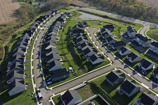 Homes in Middlesex Township, Pa., are shown on Apr. 19, 2023. A case in federal court in Missouri ended Tuesday with a jury ordering the National Association of Realtors and some of the nation's biggest real estate brokerages to pay almost $1.8 billion in damages after finding that they artificially inflated commissions paid to real estate agents. (AP Photo/Gene J. Puskar, File)