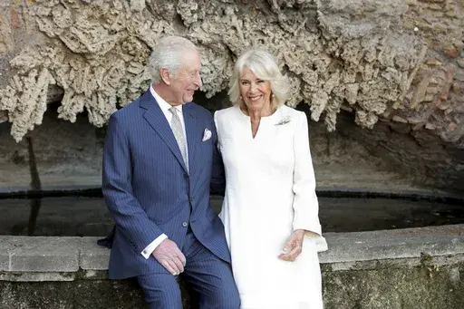 In this photo provided by Bucking Palace, Britain's King Charles III and Queen Camilla pose for a portrait at Villa Wolkonsky, in Rome, Italy, Monday, April 7, 2025. (Chris Jackson/Getty Images for Buckingham Palace via AP)