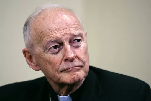 Former Washington Archbishop, Cardinal Theodore McCarrick listens during a press conference in Washington, May 16, 2006. Lawyers for former Roman Catholic Cardinal McCarrick filed a motion Monday, Feb. 27, 2023, to dismiss a case charging him with sexually assaulting a boy decades ago, saying the 92-year-old once-powerful American prelate has dementia and is not competent to stand trial. (AP Photo/J. Scott Applewhite, File)