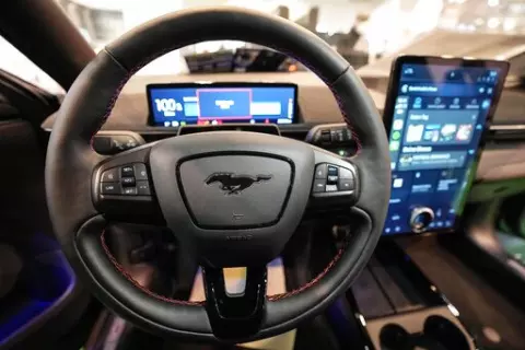 The cockpit of a Ford Mustang Mach-E electric car is pictured at the Motor Show in Essen, Germany, Thursday, Dec. 2, 2021 (AP Photo/Martin Meissner)