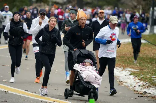 Runners take part in the 49th annual Mile High United Way Turkey Trot in southeast Denver on Nov. 24, 2022. (AP Photo/David Zalubowski, File)