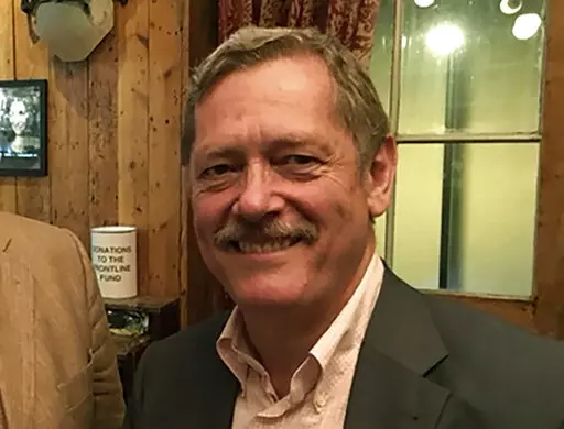 This photo provided by David Loyn shows Peter Jouvenal at the Frontline Club in London in 2017.  The U.S. and British governments, as well as a family member, say Afghanistan's Taliban rulers have detained several British citizens and an American. A statement from the British government this week said there are a number of British nationals currently in Taliban custody. While the government refused to release their identities, Hassina Syed, the wife of Peter Jouvenal, a former freelance camerama