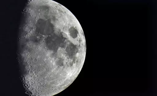 Impact craters cover the surface of the moon, seen from Berlin, Germany, Tuesday, Jan. 11, 2022. The moon is about to get walloped by 3 tons of space junk, a punch that will carve out a crater that could fit several semitractor-trailers. A leftover rocket is expected to smash into the far side of the moon at 5,800 mph (9,300 kph) on Friday, March 4, 2022, away from telescopes’ prying eyes. It may take weeks, even months, to confirm the impact through satellite images. (AP Photo/Michael Sohn, F
