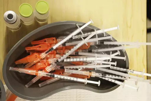 Pre-loaded syringes with COVID-19 vaccine are ready for use in New Orleans, on Jan. 25, 2022. The COVID-19 vaccines are on track for a big recipe change this fall. Scientific advisers for the Food and Drug Administration on Thursday, June 15, 2023, discussed whether the next round of shots should only include protection against the newest omicron strains that are now dominant worldwide. (AP Photo/Ted Jackson, File)