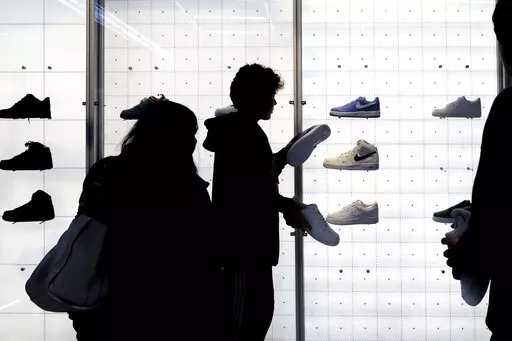 People shop for shoes in a Nike store on , Nov. 25, 2022, in New York. “Buy now, pay later” services like Affirm, Afterpay and Klarna can sometimes provide a cheaper, more accessible version of credit. These services essentially provide customers an alternative way to pay for purchases over time without going into credit card debt or taking out a traditional personal loan. Travel purchases, such as airfare and vacation rentals, are the fastest-growing segment for buy now, pay later services.