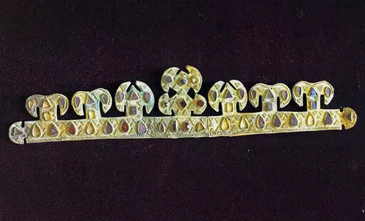 The 1,500 year-old golden tiara, inlaid with precious stones, one of the world's most valuable artifacts from the blood-letting rule of Attila the Hun, is seen in a museum in Melitopol, Ukraine, in November 2020. Russian troops stole and carted away the priceless crown and a hoard of other treasures after capturing the Ukrainian city of Melitopol in February. (AP Photo)