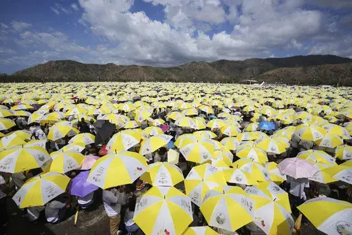 East Timorese crowd Tasitolu park for Pope Francis' Mass in Dili, East Timor, Tuesday, Sept. 10, 2024. (AP Photo/Firdia Lisnawati)