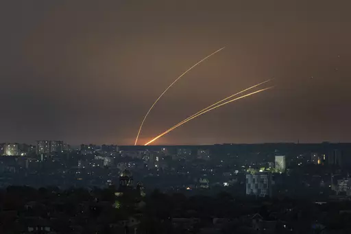 Russian rockets are launched against Ukraine from Russia's Belgorod region, seen from Kharkiv, Ukraine, on Thursday, April 18, 2024. (AP Photo/Evgeniy Maloletka)