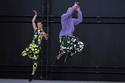 Models wear creations as part of Issey Miyake Homme Plisse men's Spring Summer 2023 collection presented in Paris, France, Thursday, June 23, 2022. (AP Photo/Francois Mori)